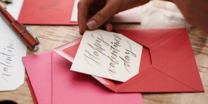 Visconti Homo Sapiens Lava next to handwritten card in red envelope