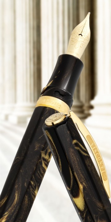Visconti Medici black and gold fountain pen in front of marble columns